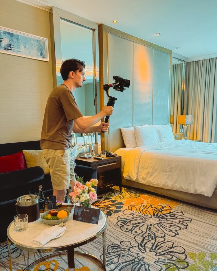 Andrei Kosnio filming commercial content in a hotel