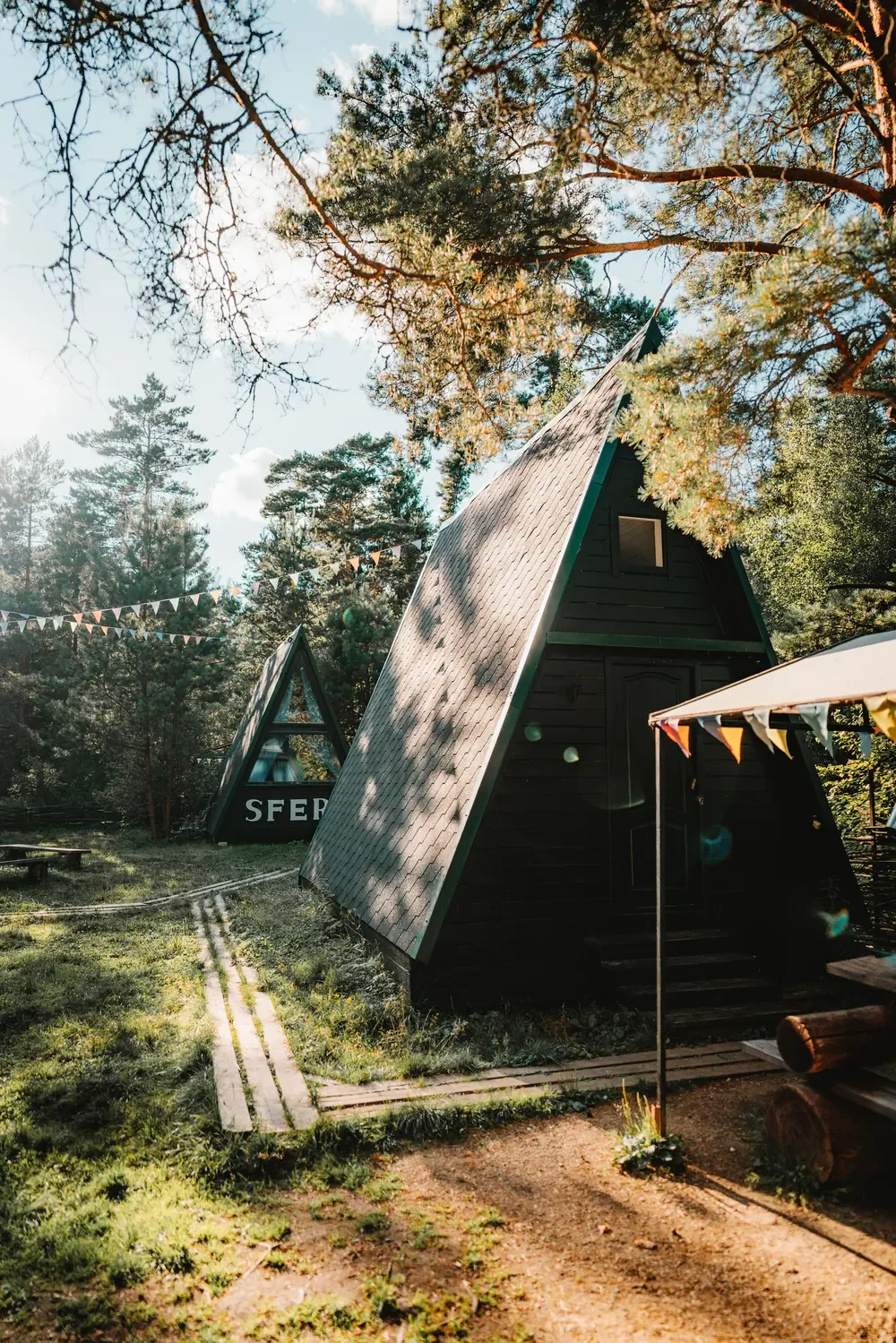 A-frame cabin lit by late afternoon sun