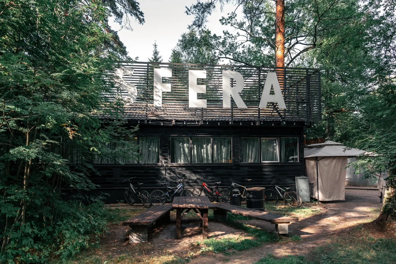 Entrance to Sfera eco-camping surrounded by forest
