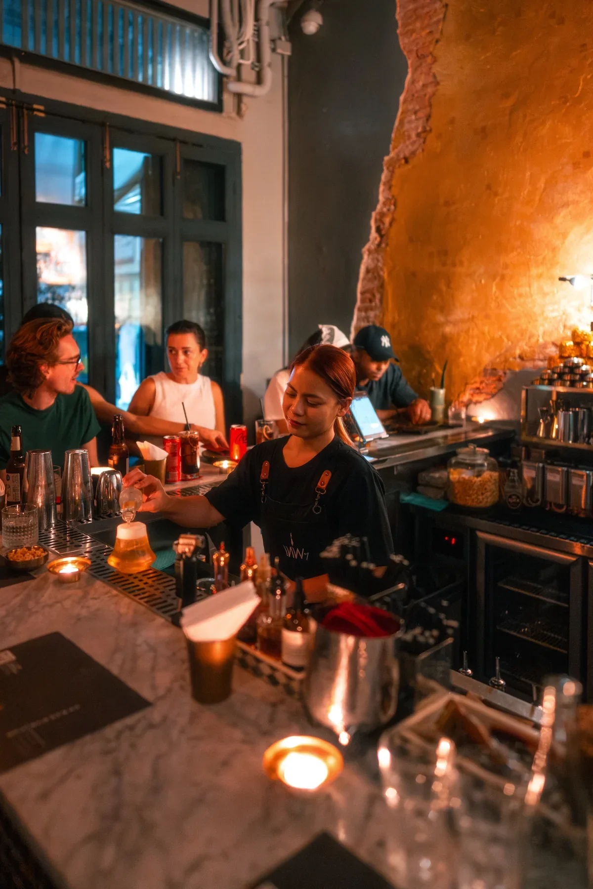 Bar team preparing drinks during service