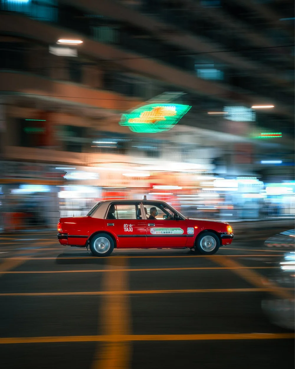 Red taxi photographed at night with the Echo look
