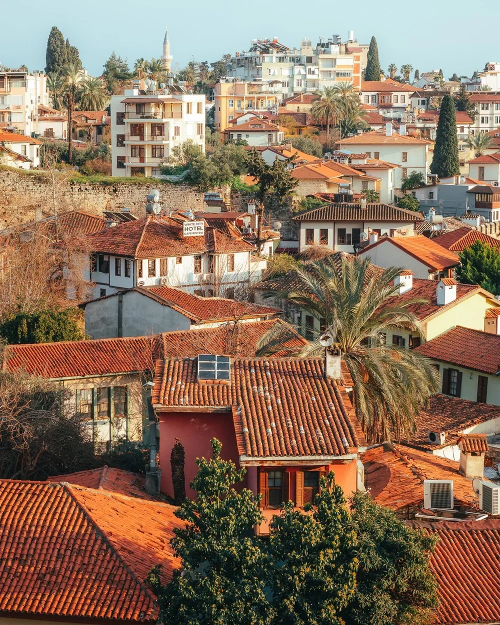 Warm rooftops and hillside buildings photographed while travelling