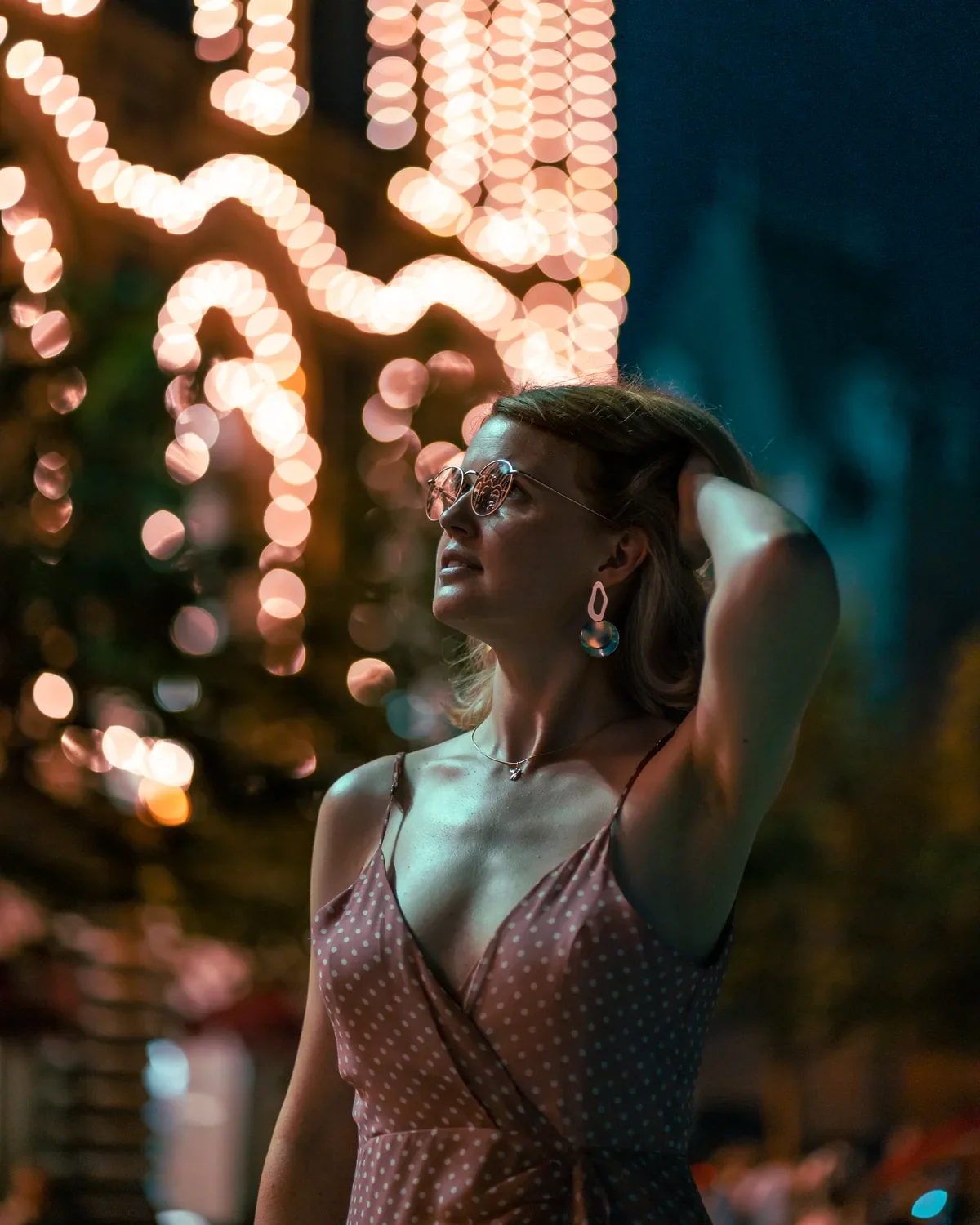 Lifestyle portrait with TIJN glasses and warm city lights