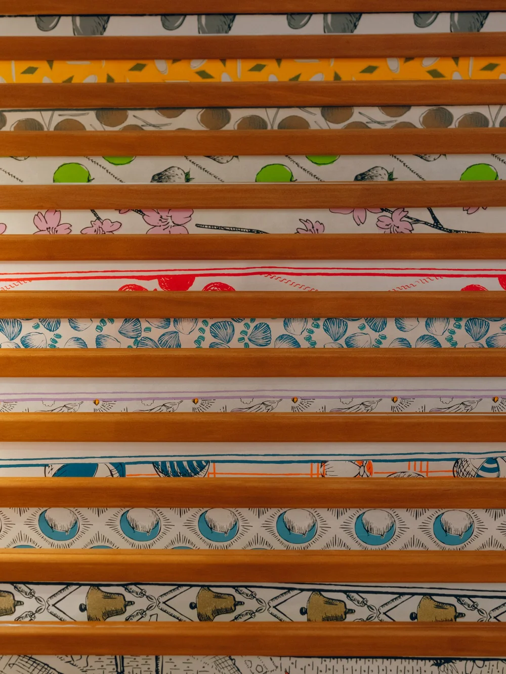 Colourful patterned sheets of Korean hanji arranged on a display rack