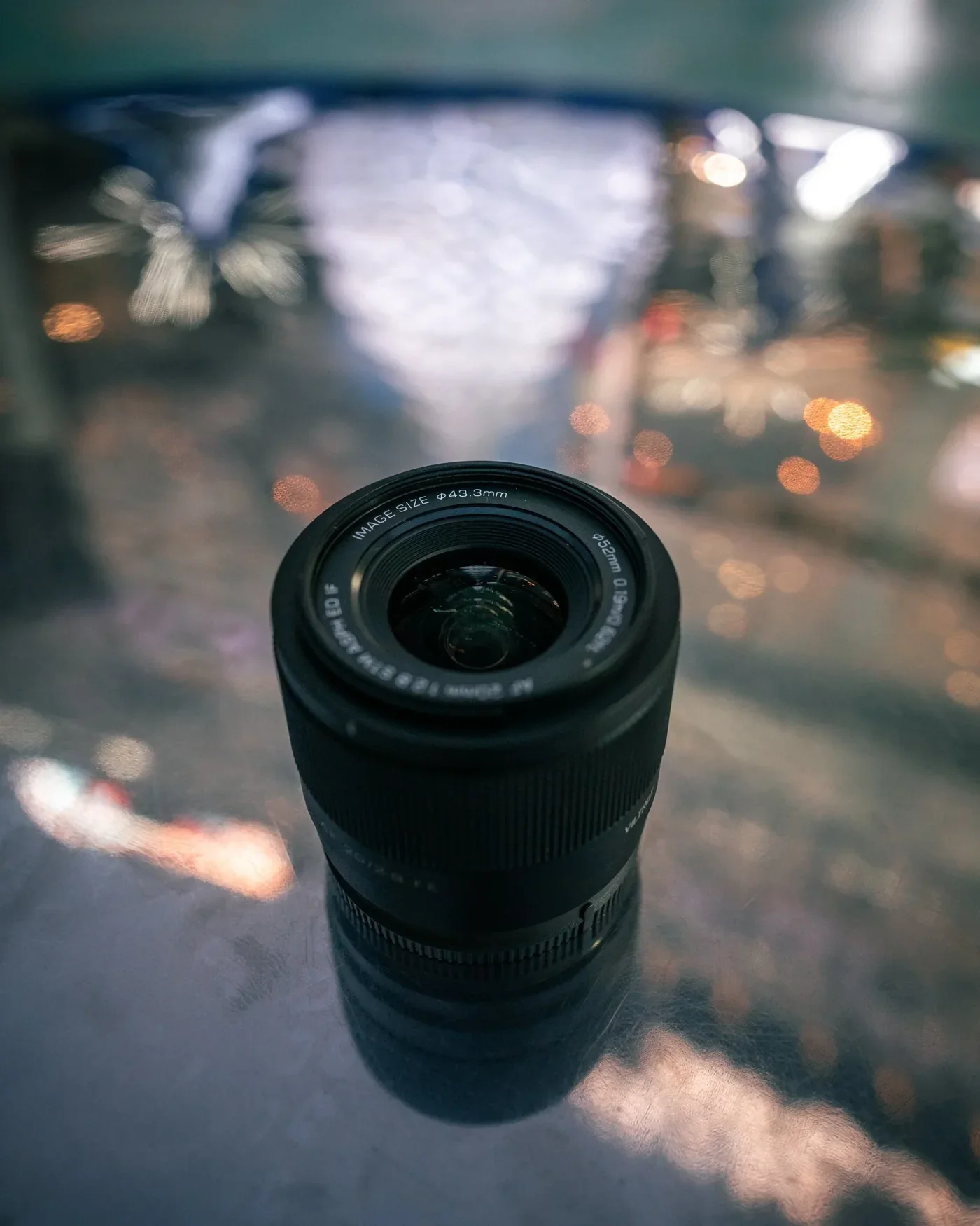Viltrox lens photographed against city lights