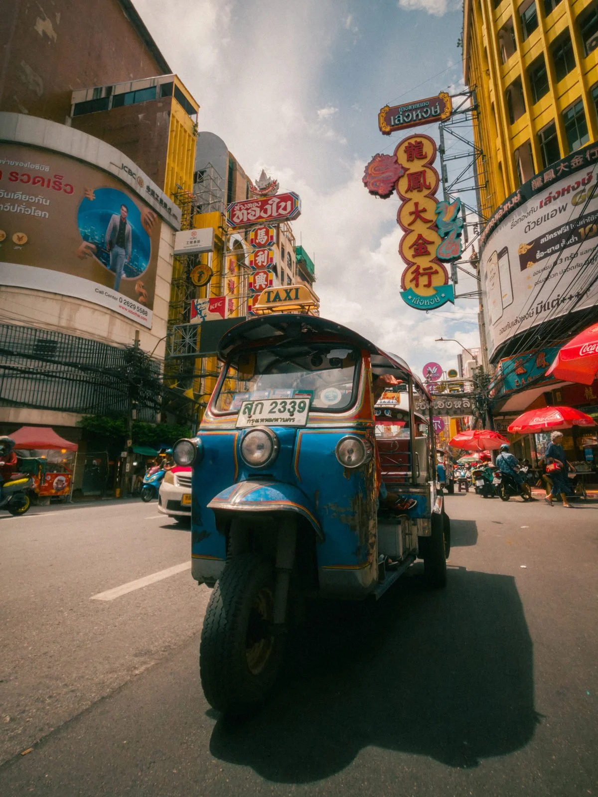Tuk-tuk moving through Bangkok Chinatown