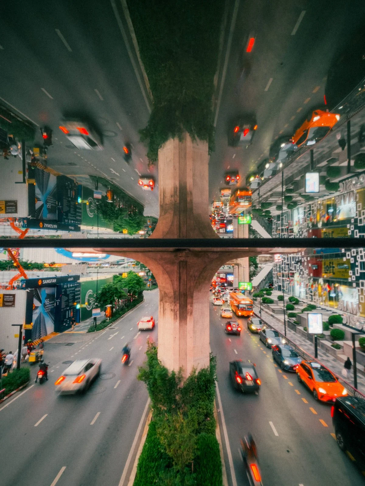 Bangkok night traffic beneath elevated roads