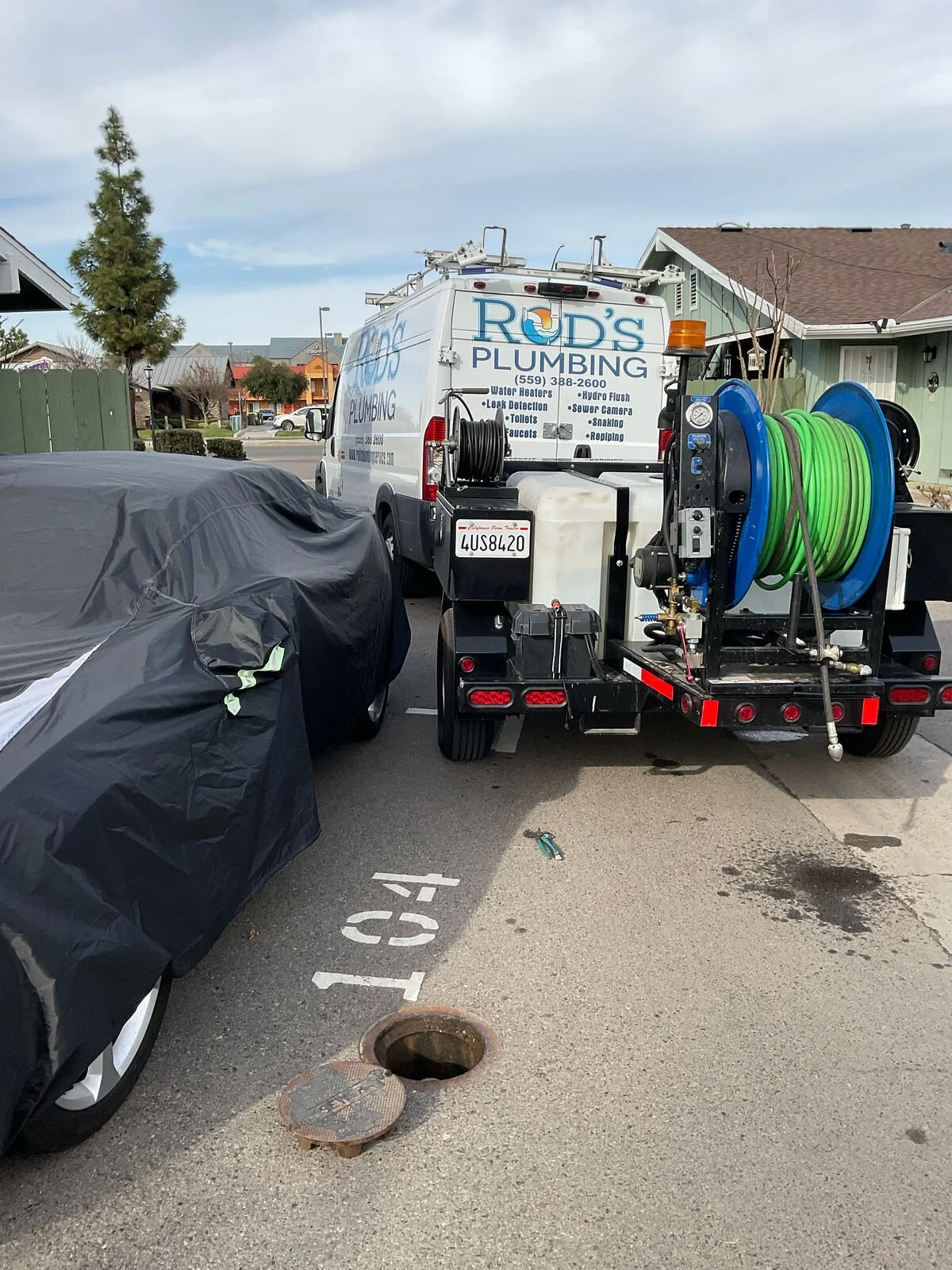 Rod's Plumbing hydro jetting trailer at a Fresno drain cleaning job