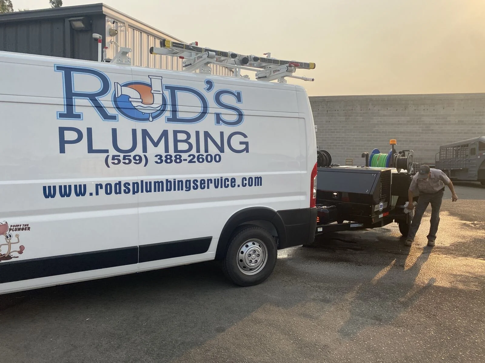 Rod's Plumbing Service crew and lettered service truck in Fresno, CA