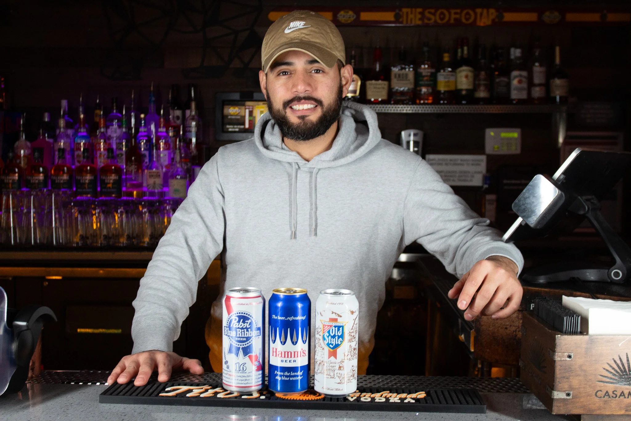 Bartender serving drinks at The SoFo Tap - affordable LGBTQ+ bar in Andersonville Chicago