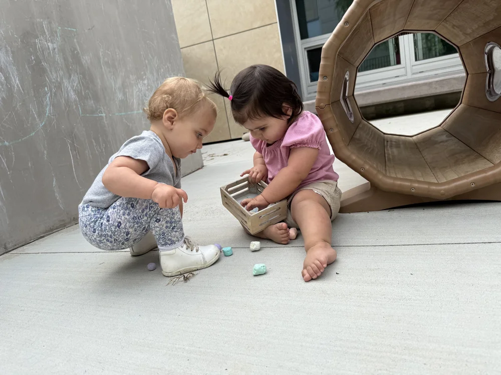 Infants and toddlers exploring together at the Lab School