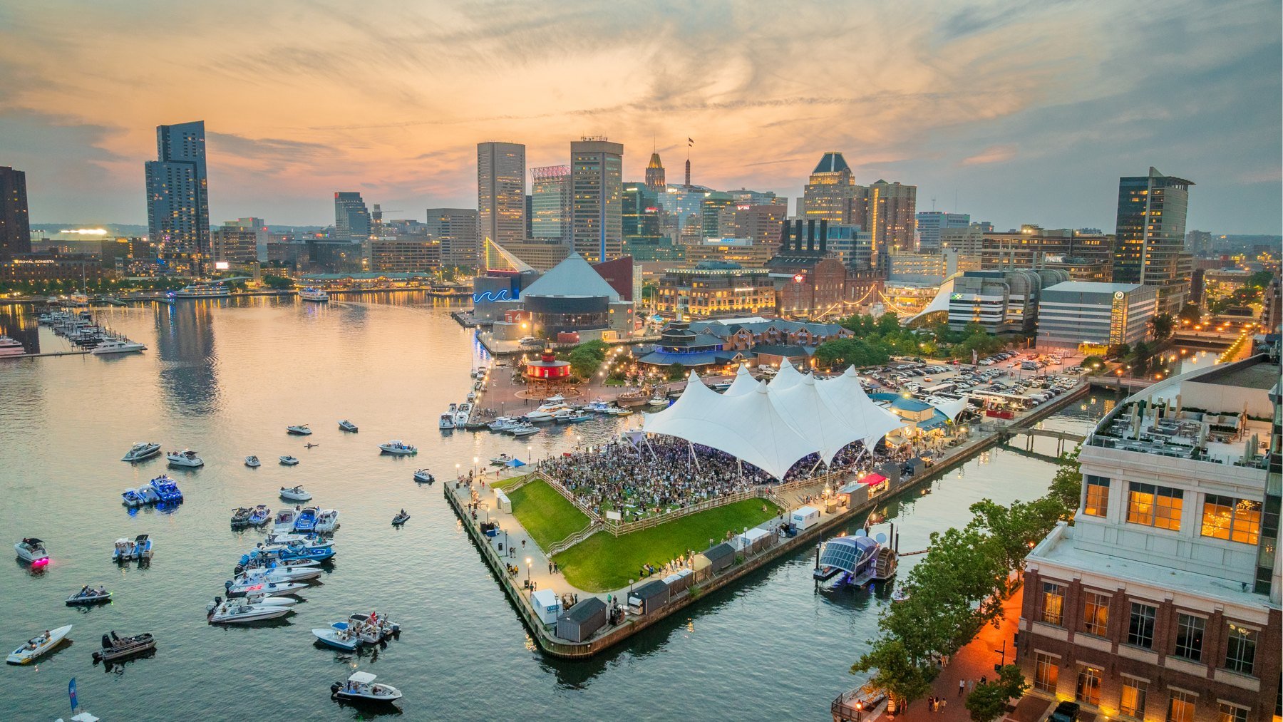Aerial photography of Baltimore’s Inner Harbor and Pier Six at sunset.