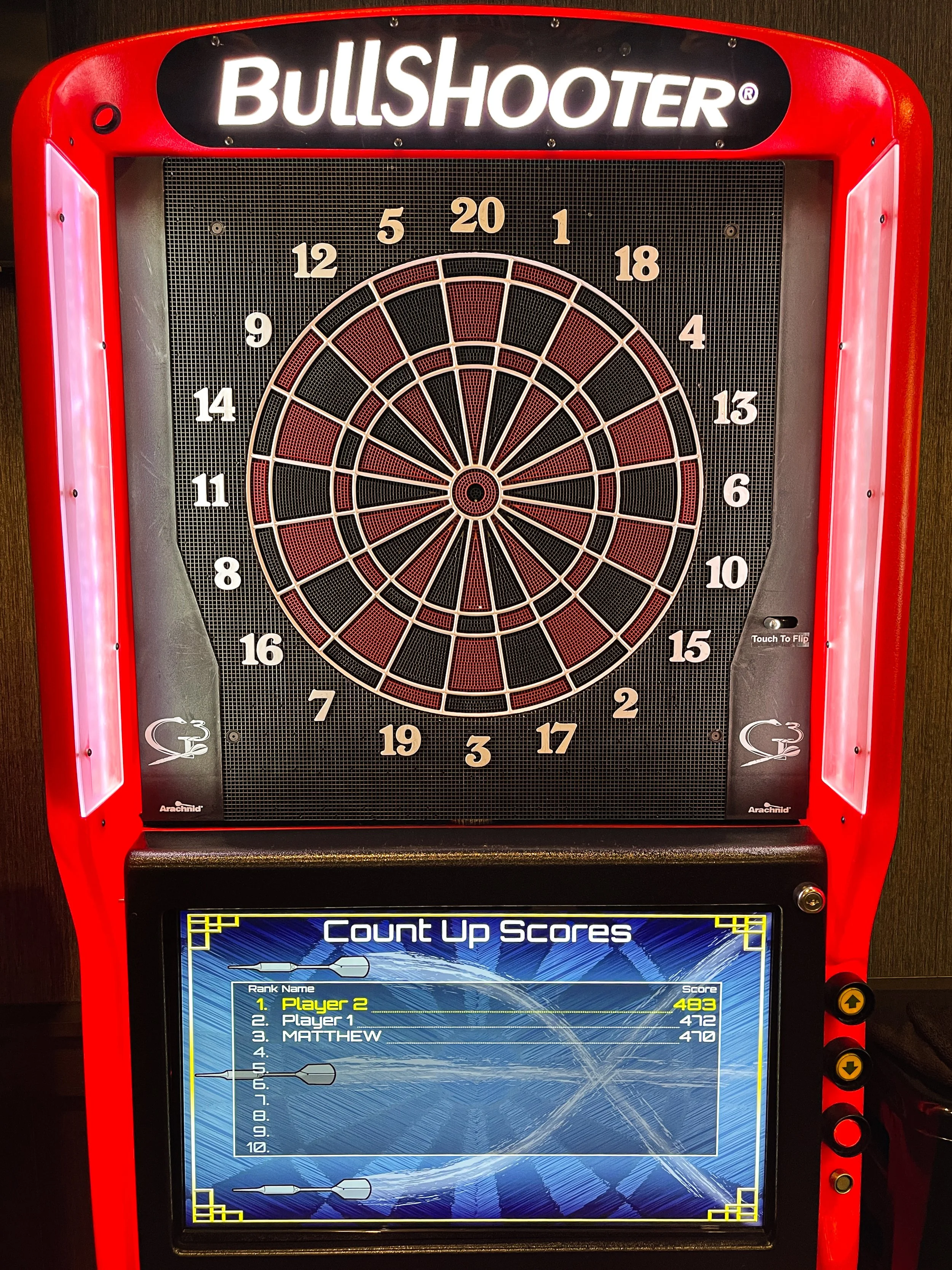 Dart board at 2Bears Tavern Uptown bar in Chicago &mdash; one of several games available including pinball and Nintendo Switch