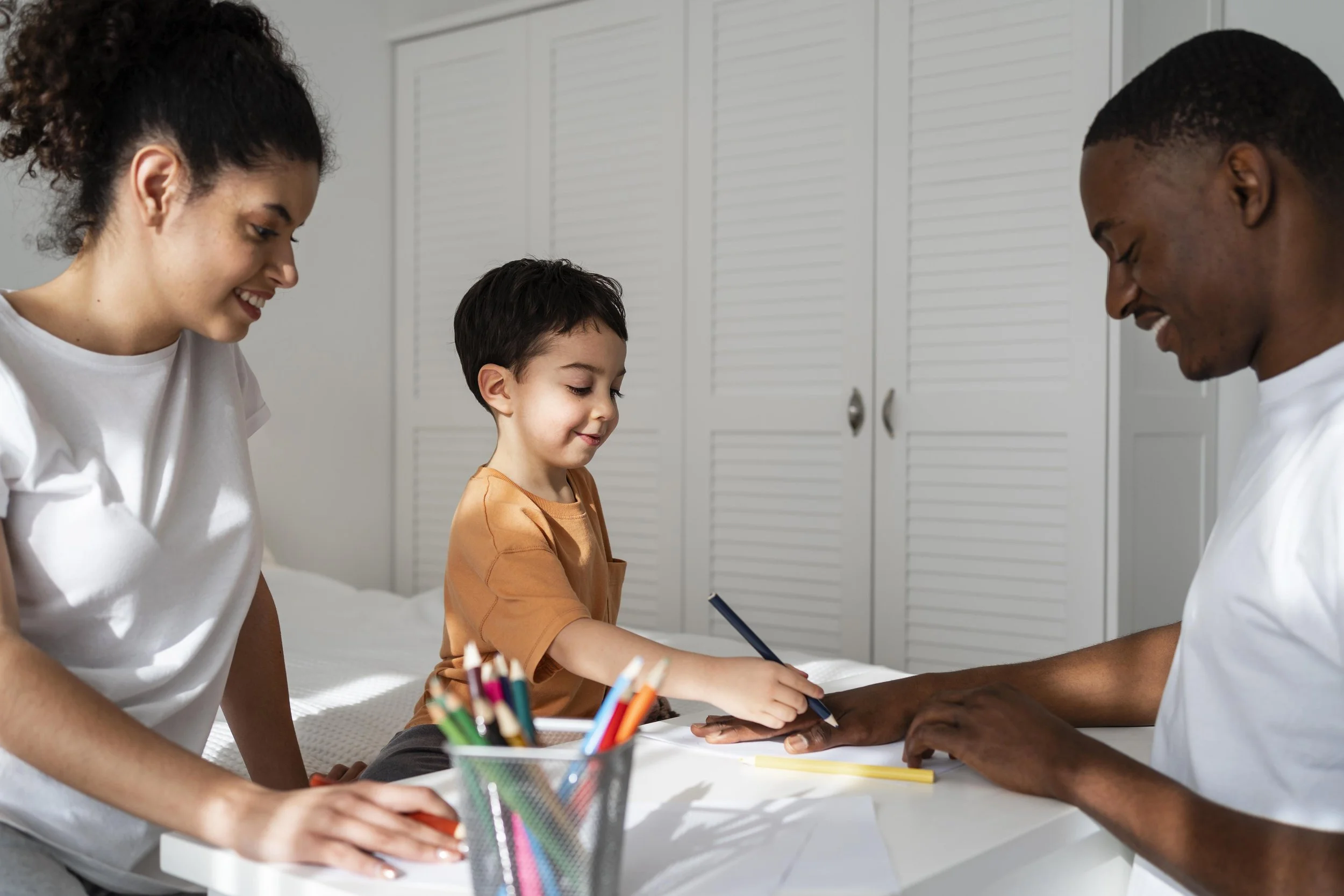 A child drawing with a parent.
