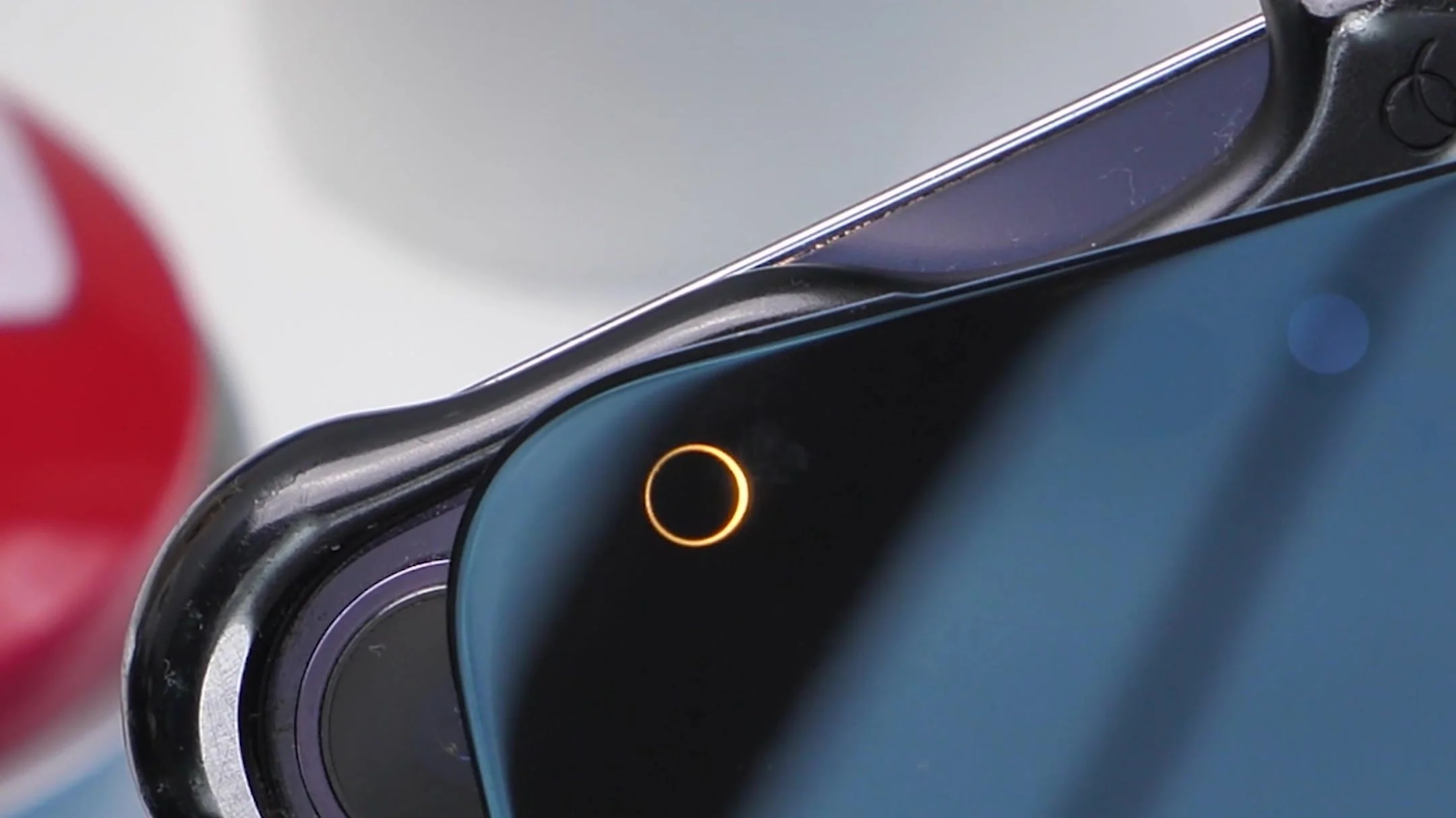 The flashlight reveals an opening near the corner of the iPhone 18 Pro Max screen.