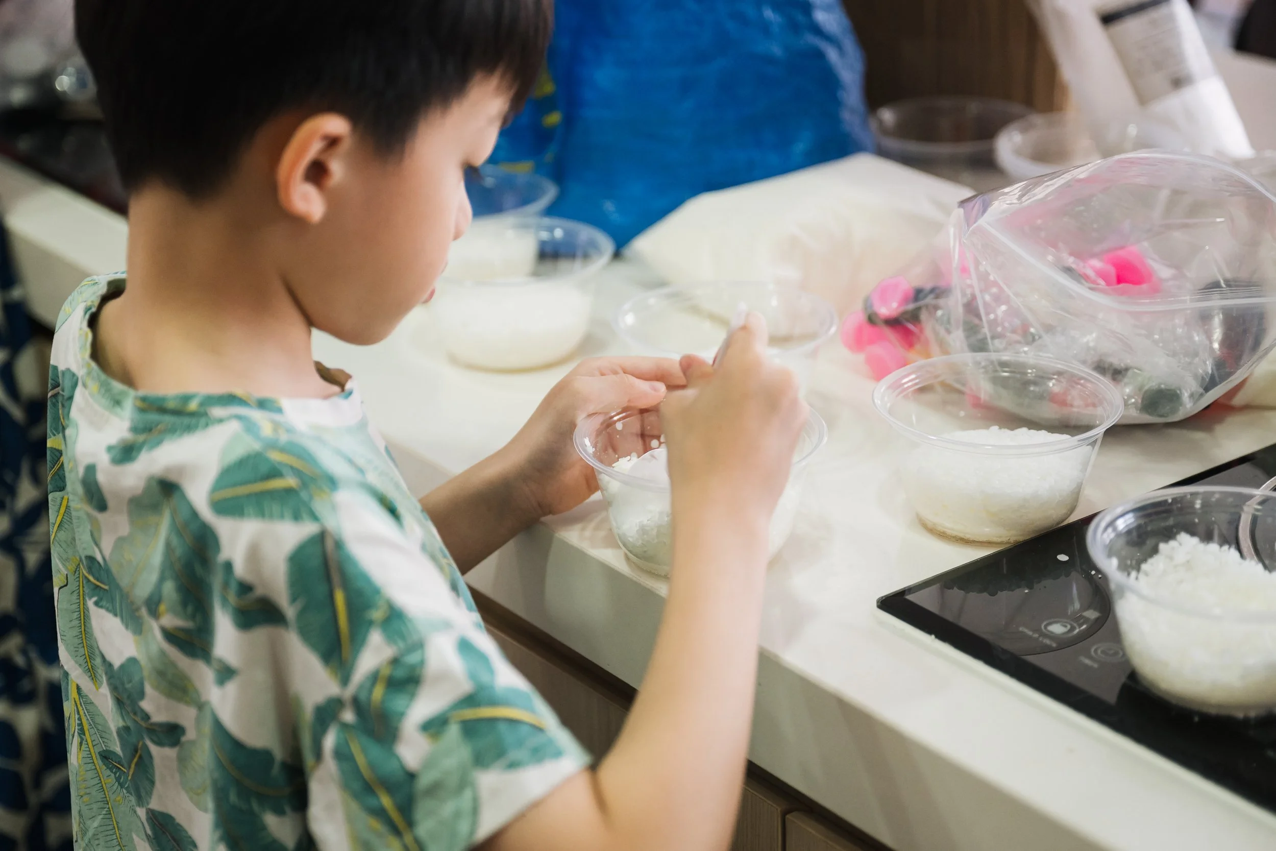 Parent and child collaborating during a corporate family engagement programme in Singapore