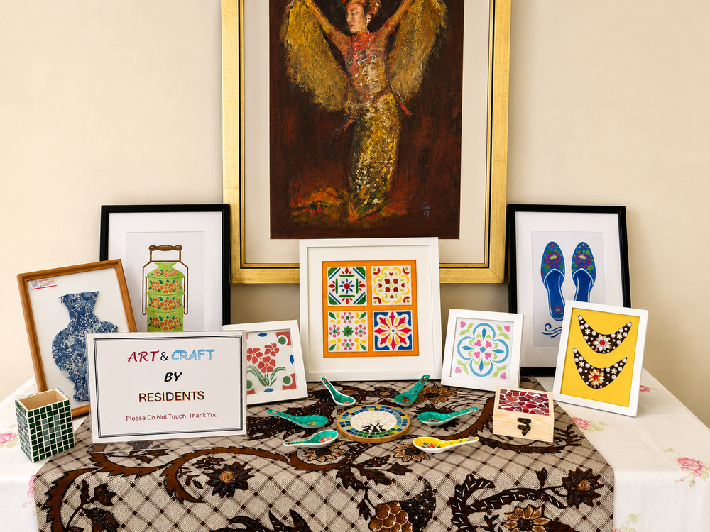 Community art display by residents featuring framed artworks and handmade craft pieces