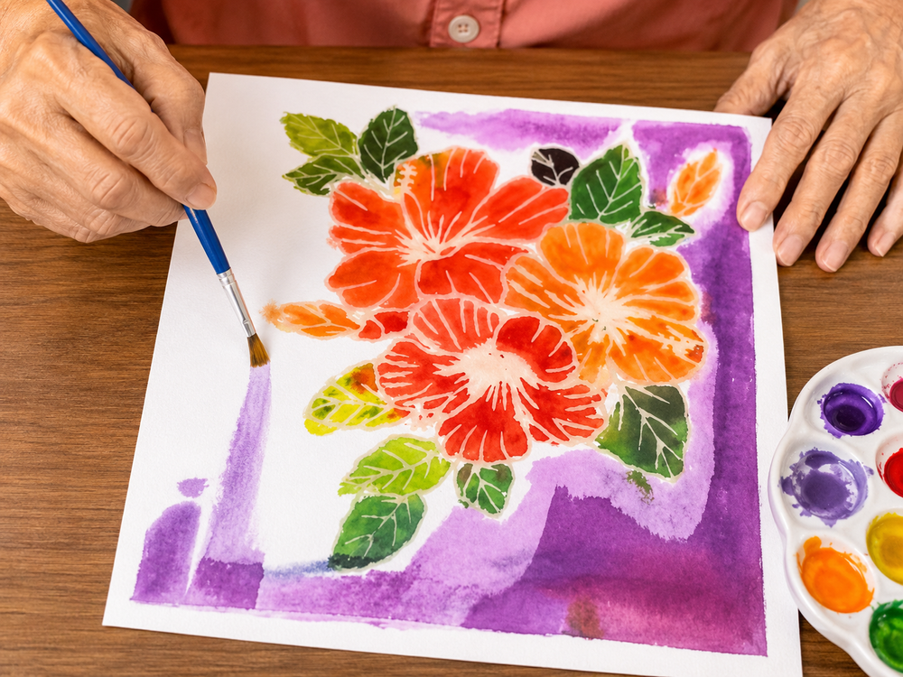Participant painting a floral artwork inspired by art history during an inclusive craft workshop