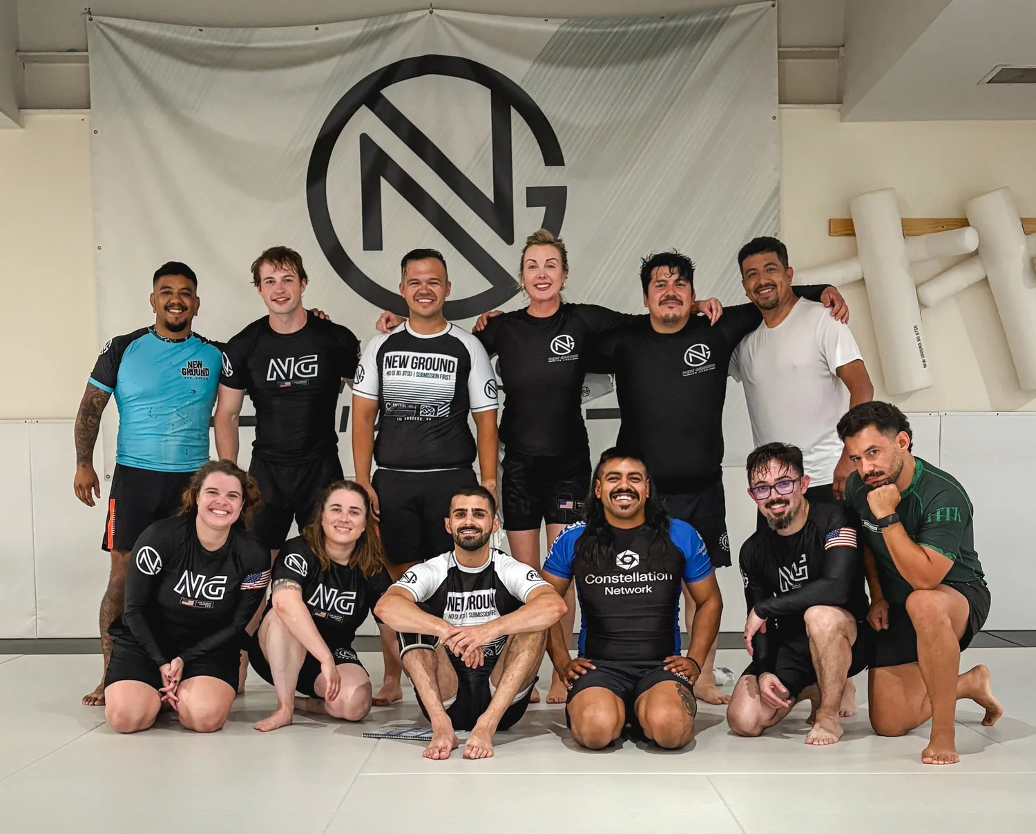 A Zero to Beginner cohort on graduation day at New Ground Jiu Jitsu