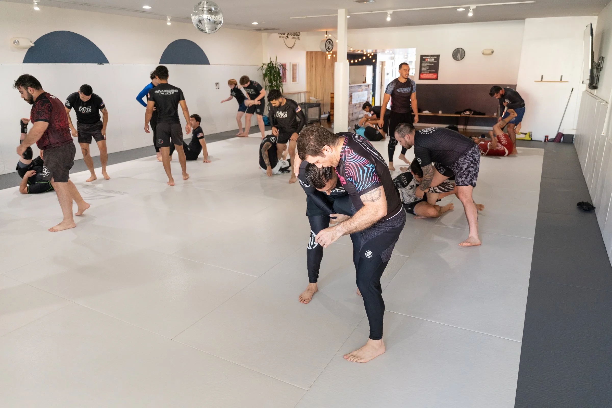 A full mat of members drilling at New Ground Jiu Jitsu