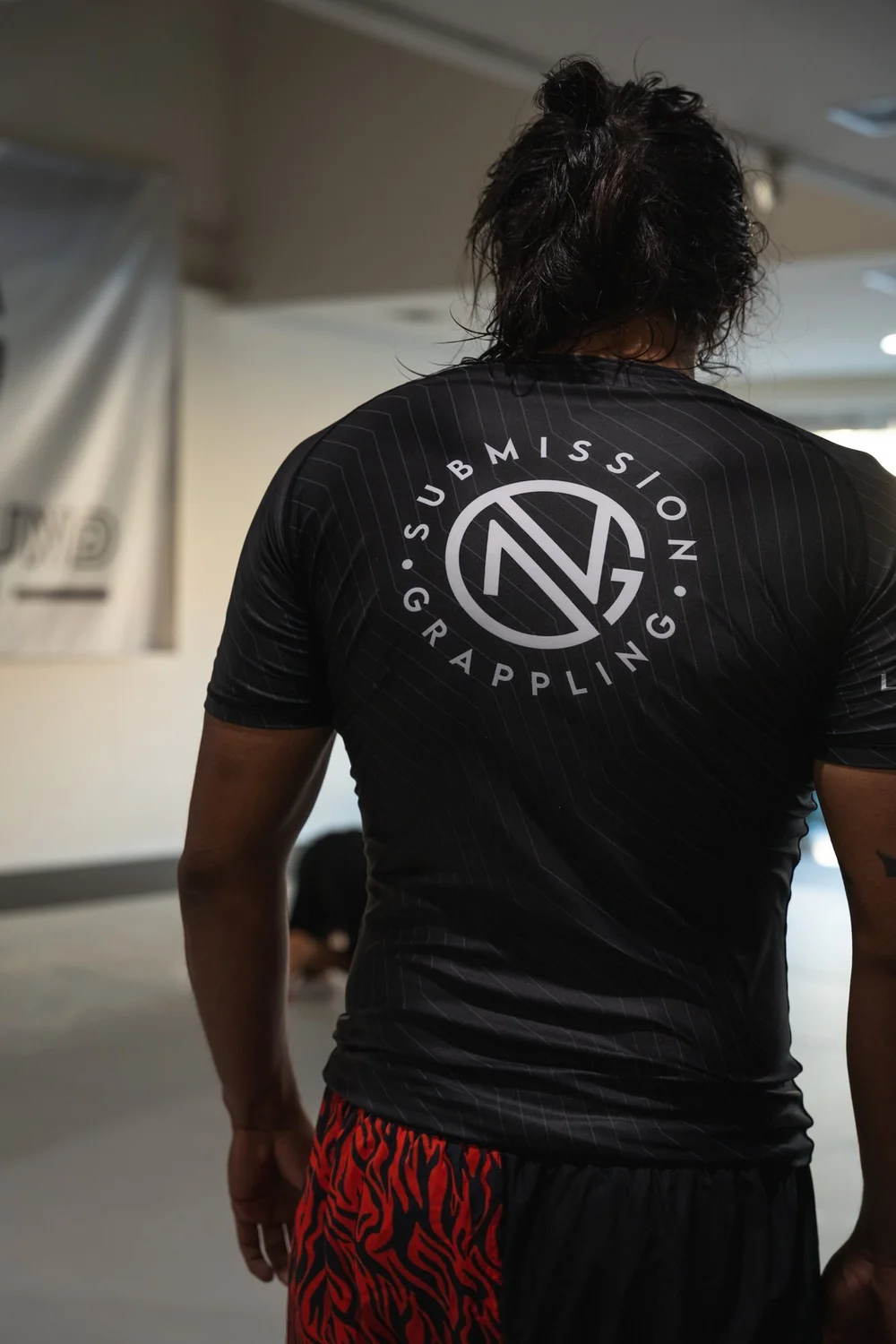 The back of a New Ground rashguard