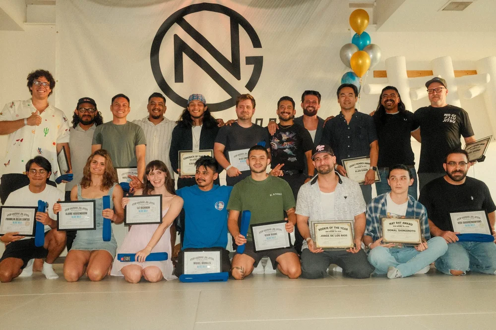 Members holding certificates after a belt promotion