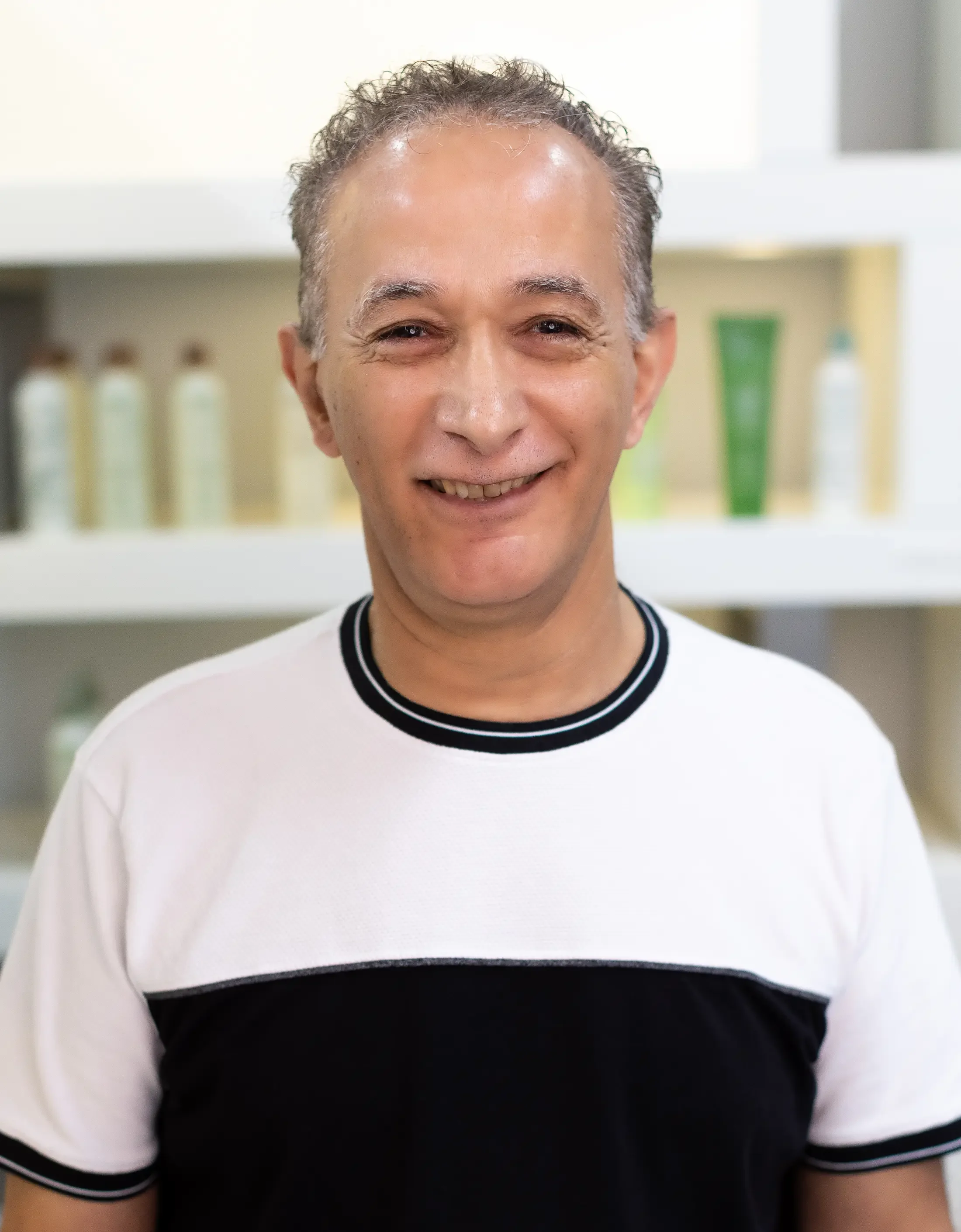Ahmed — traditional perm specialist at Junko Hair Studio Atlanta