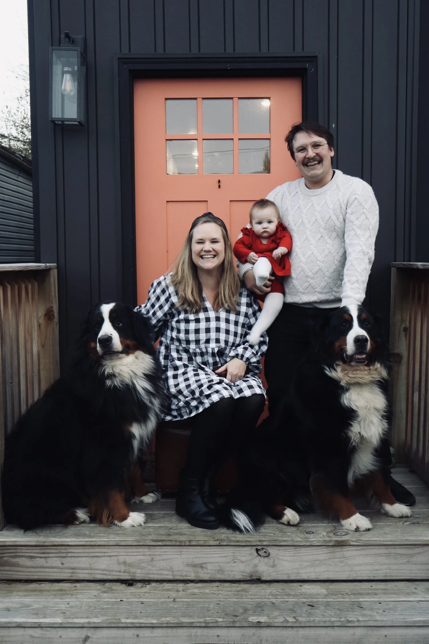 Joe Gibbs and Victoria Sanders with their daughter and dogs outside their Louisville home