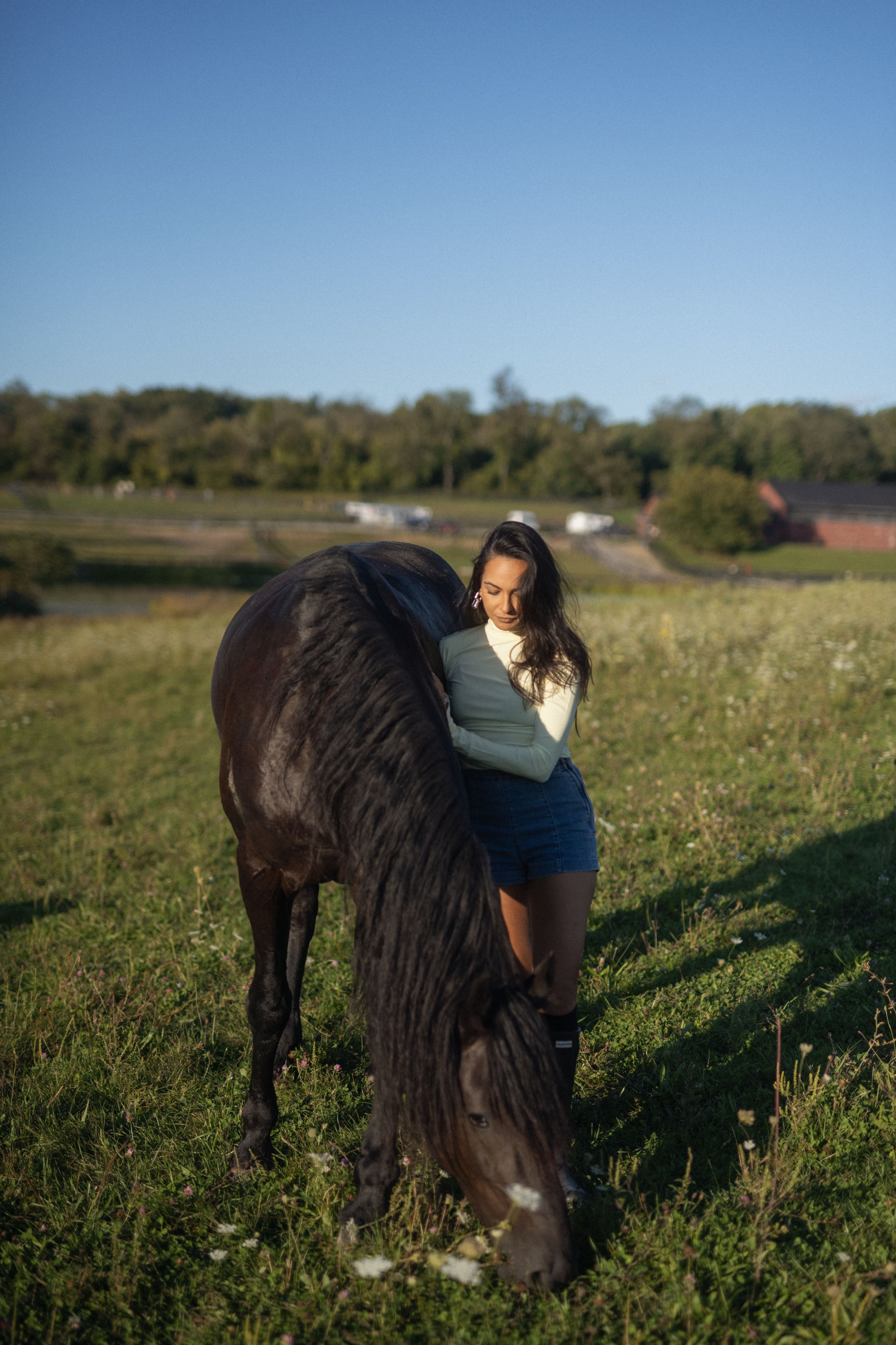 Bee standing with horse at the farm