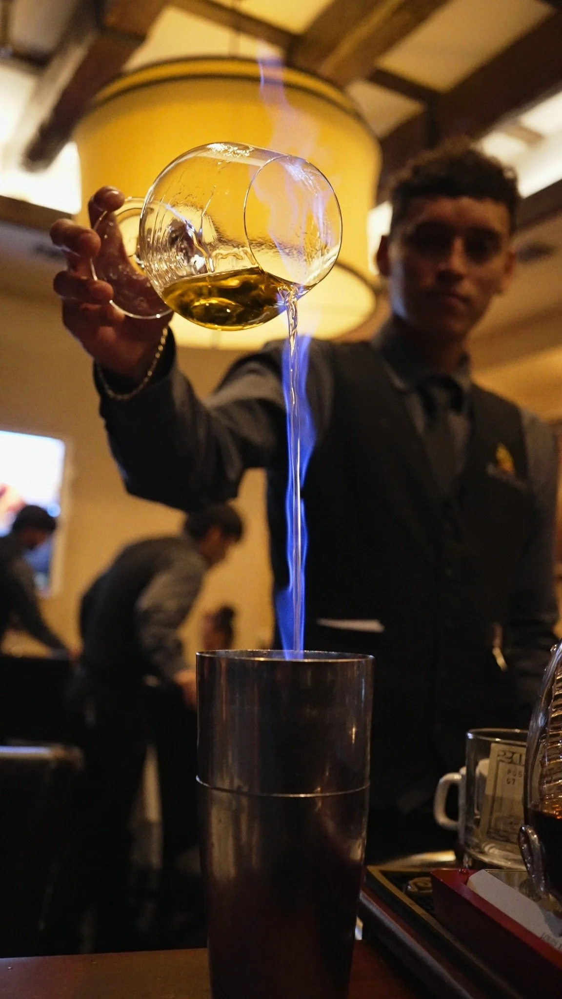 Flaming cocktail pour