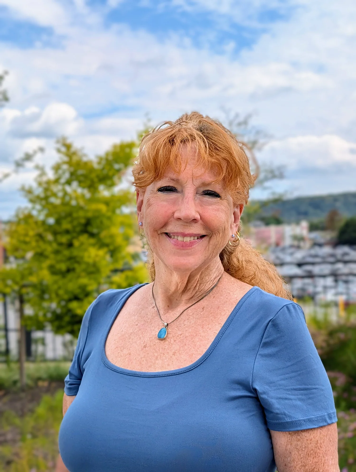 Jill Basye-Featherston smiling outdoors, Master ThetaHealing instructor and founder of Theta Grace.