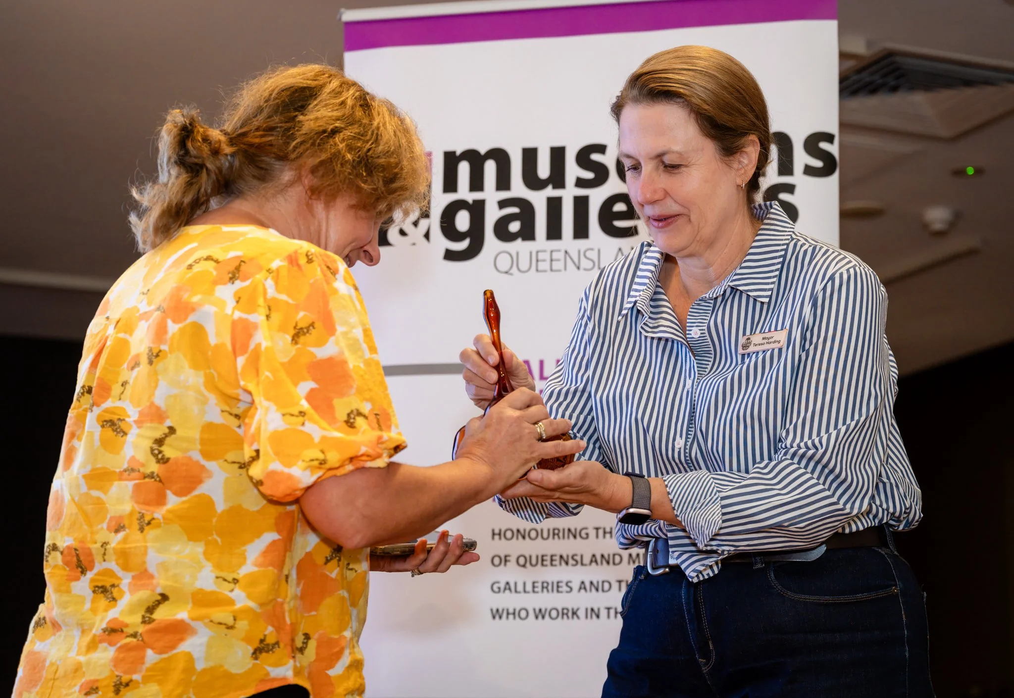 Mayor Teresa Harding presenting Renata Musson with the award