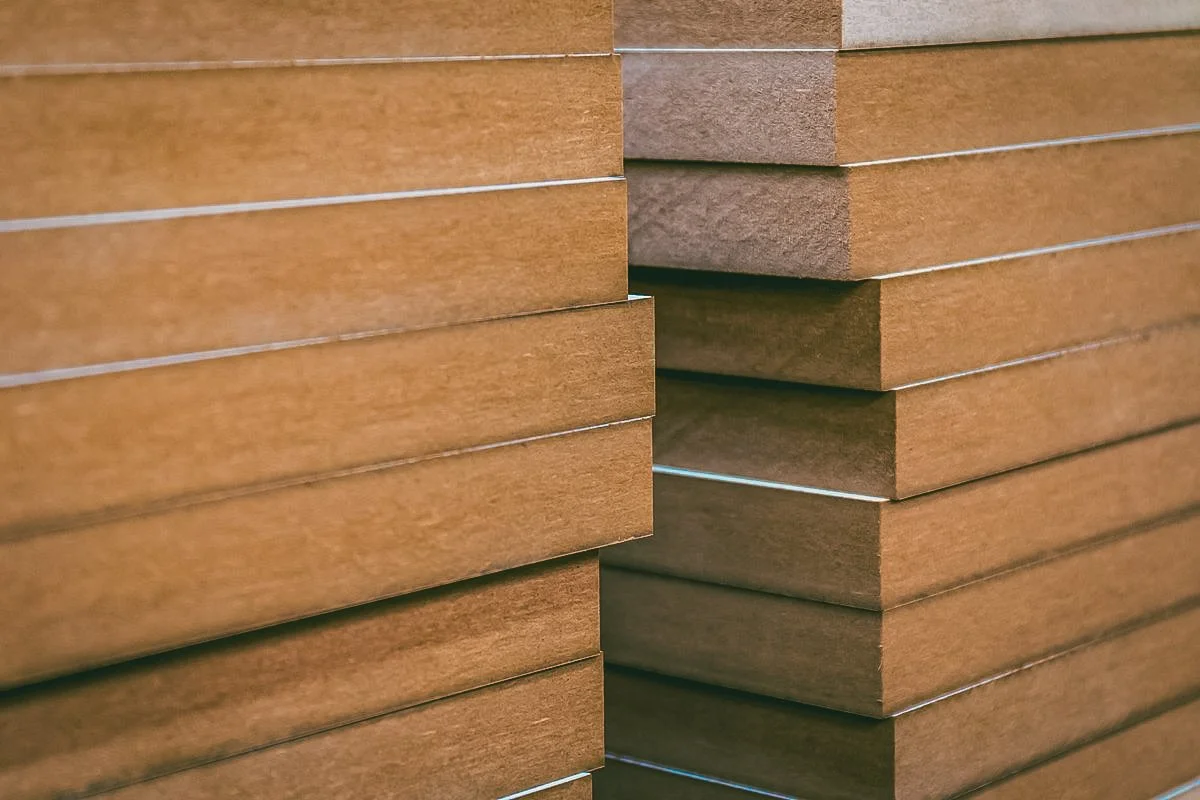 Close view of MDF showing a smooth engineered wood panel edge