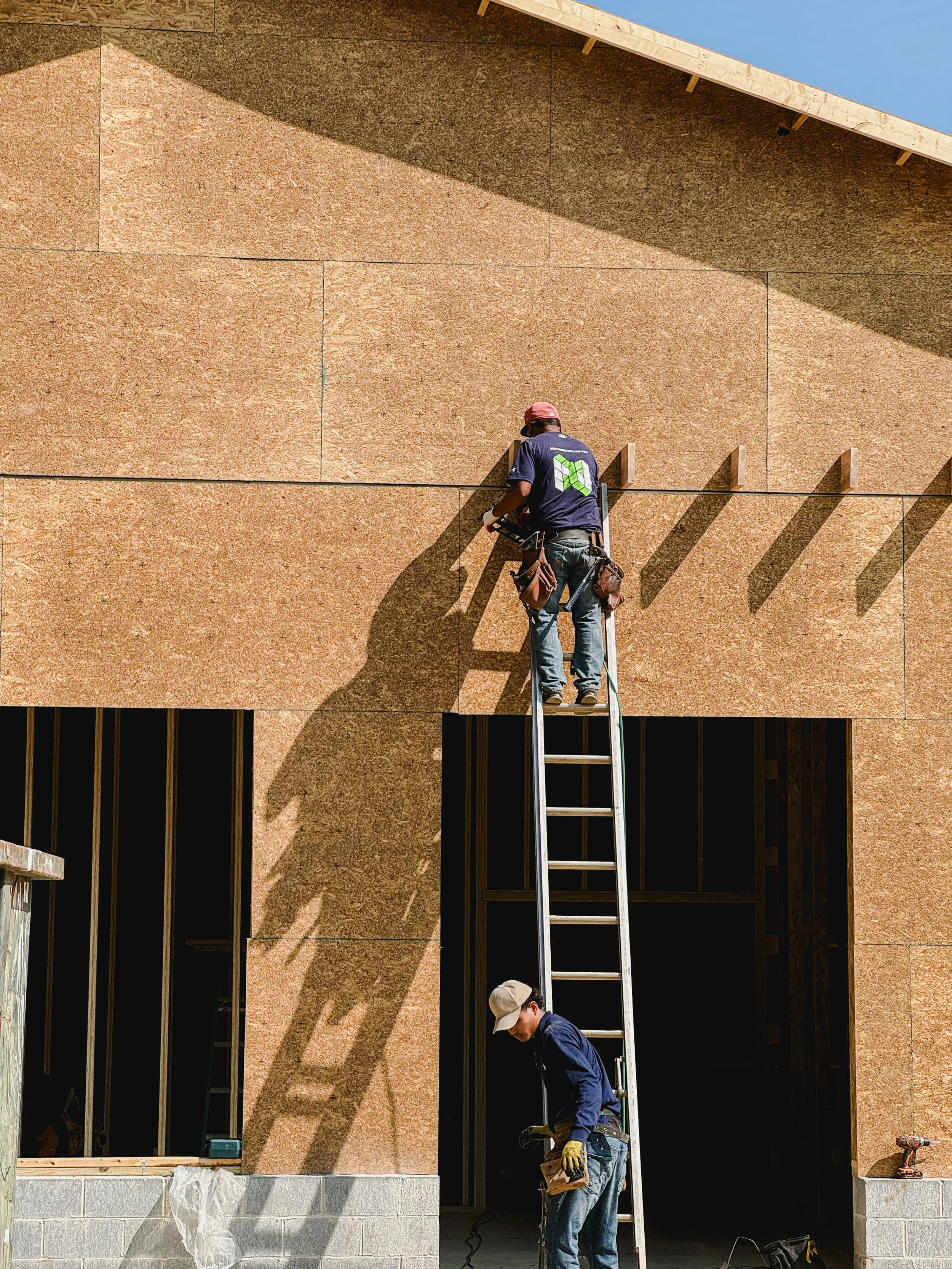 Reimagine Remodeling carpenters installing exterior framing and sheathing