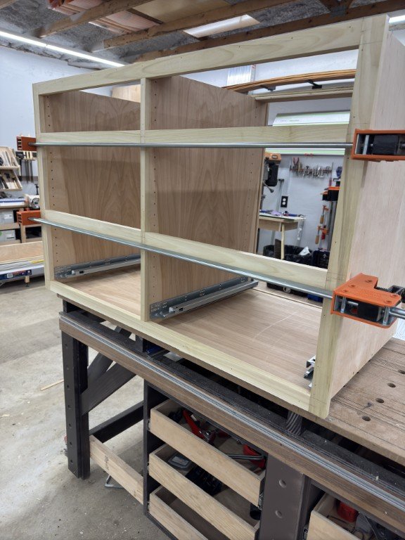 Custom kitchen cabinets with clean lines, hardware, and built-in storage