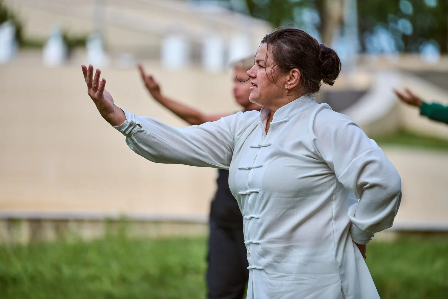 Gentle Qigong movements for autoimmune health - practitioner demonstrating flowing exercises