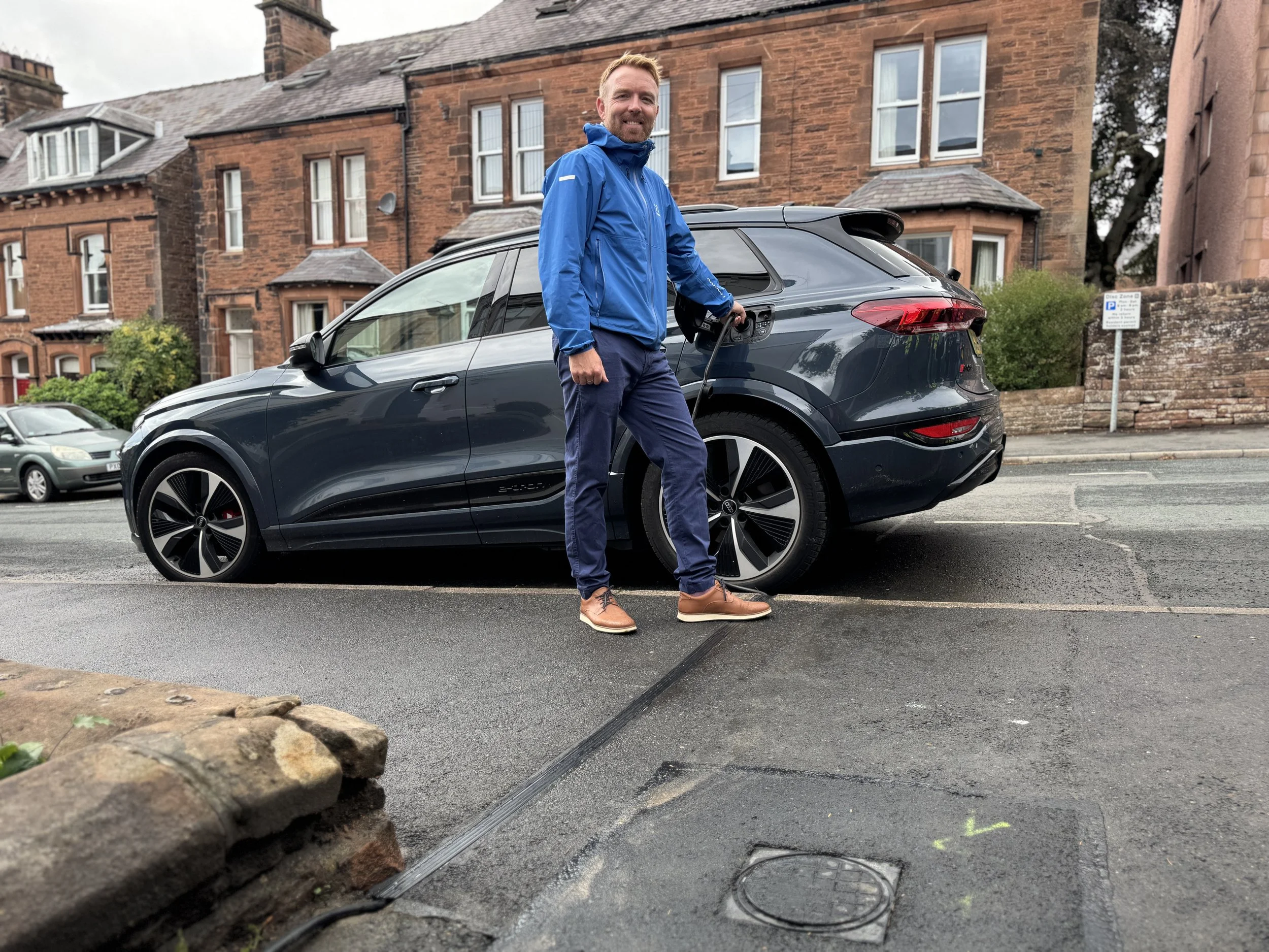 Kerbo Charge customer charging his car at the kerb, cable running through the channel
