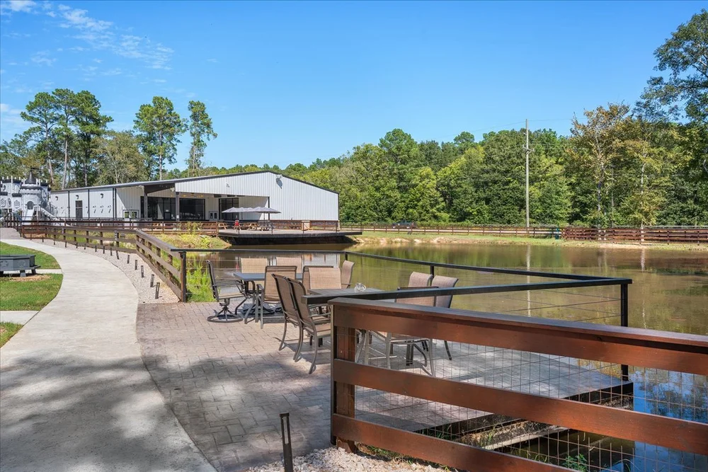 Deck overlooking the pond with outdoor seating