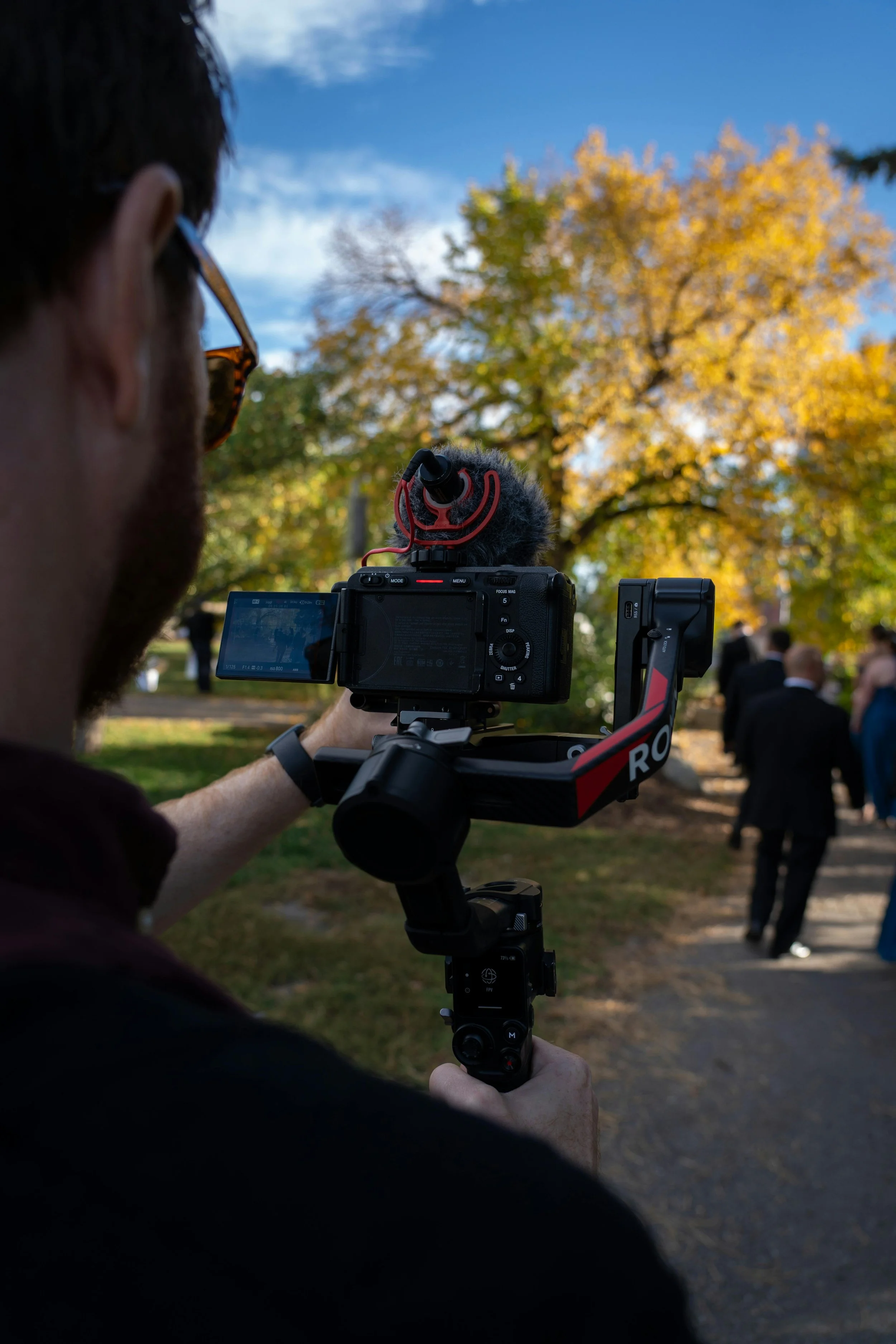 Filmmaker setting up a shot on location