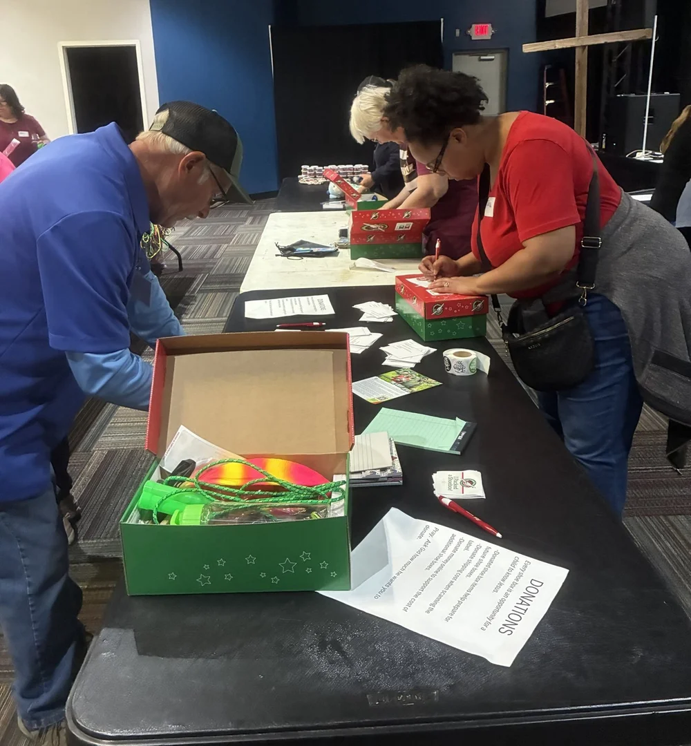 Volunteers labeling Operation Christmas Child shoeboxes