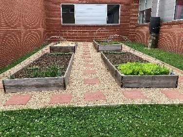 Raised garden beds built by Helping Hands volunteers