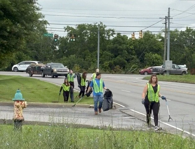 Volunteers cleaning up along a busy Gallatin road