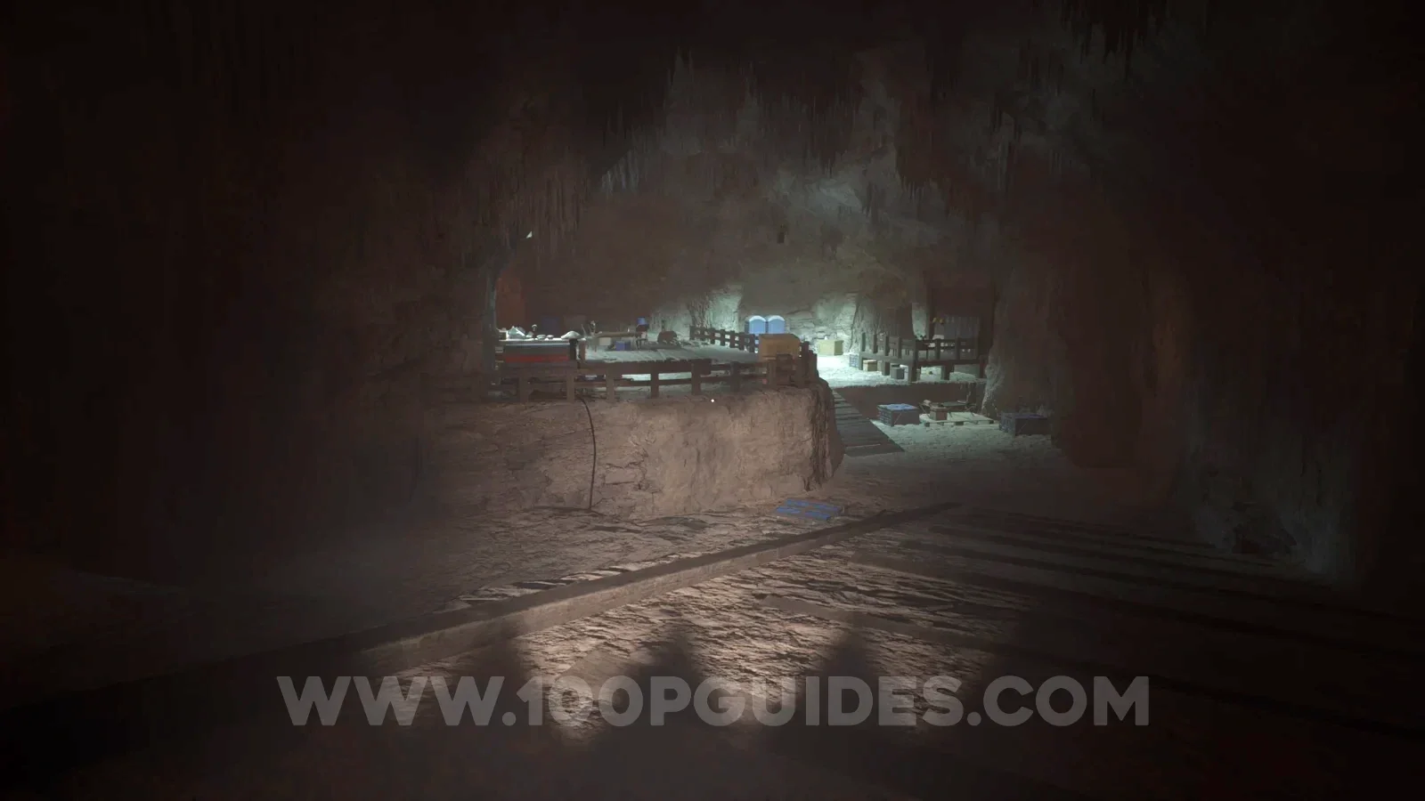 Terrible Lizards Chapter 2: heading into the cave full of equipment to the left of the large metal door