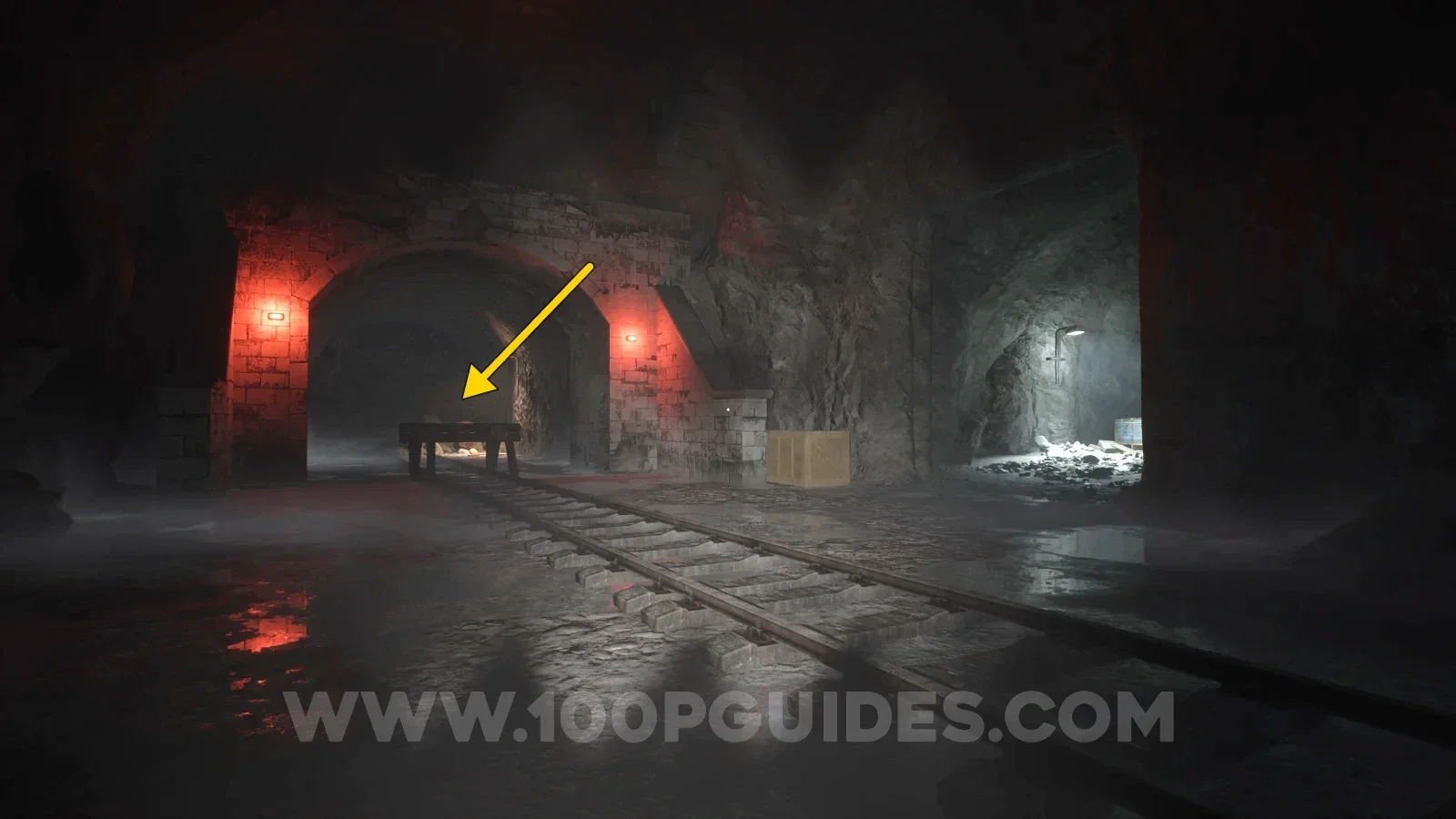 Terrible Lizards Chapter 3: tunnel with red lights at the end to the left of the two small buildings