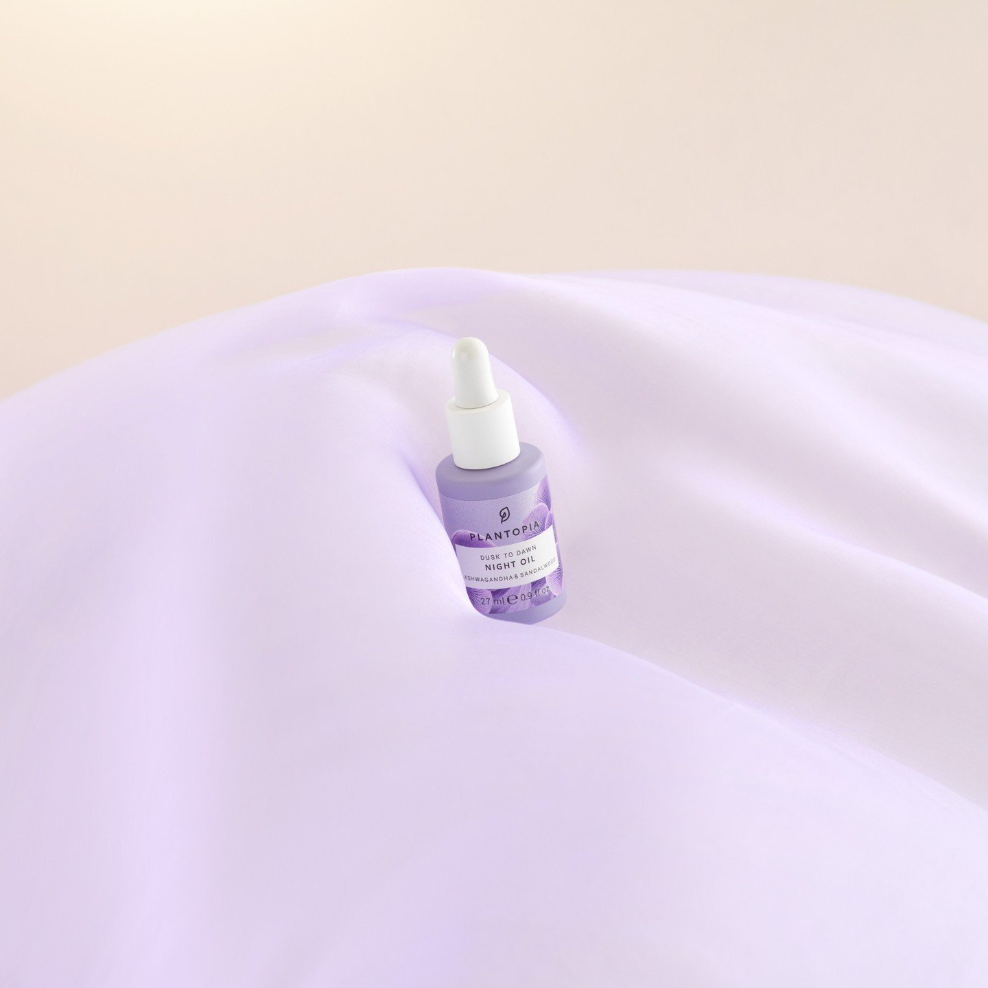 Existing Plantopia Dusk to Dawn Night Oil photograph, the lavender bottle resting on lilac silk
