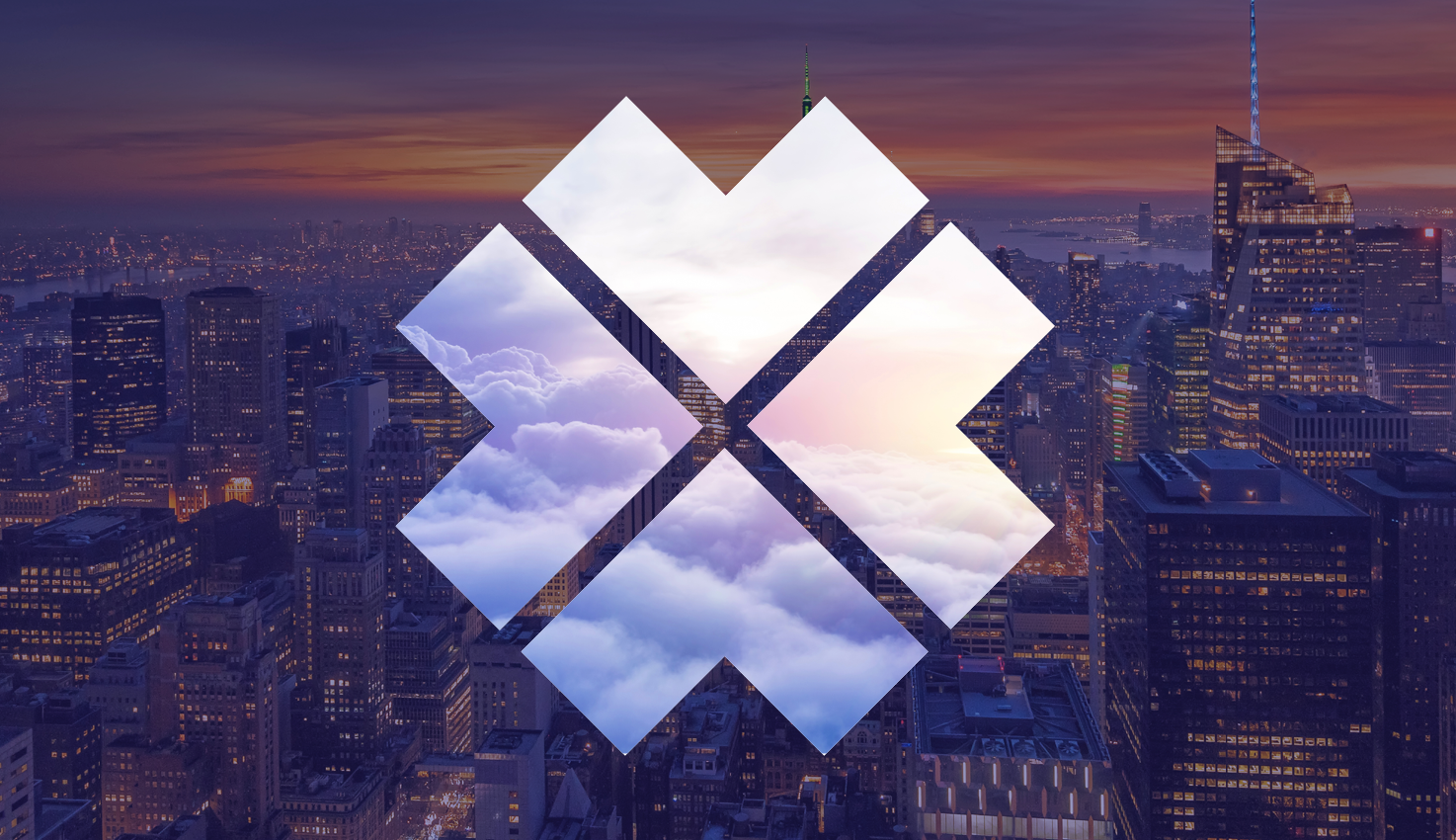 Original Just Business cloud-filled symbol over a city at dusk