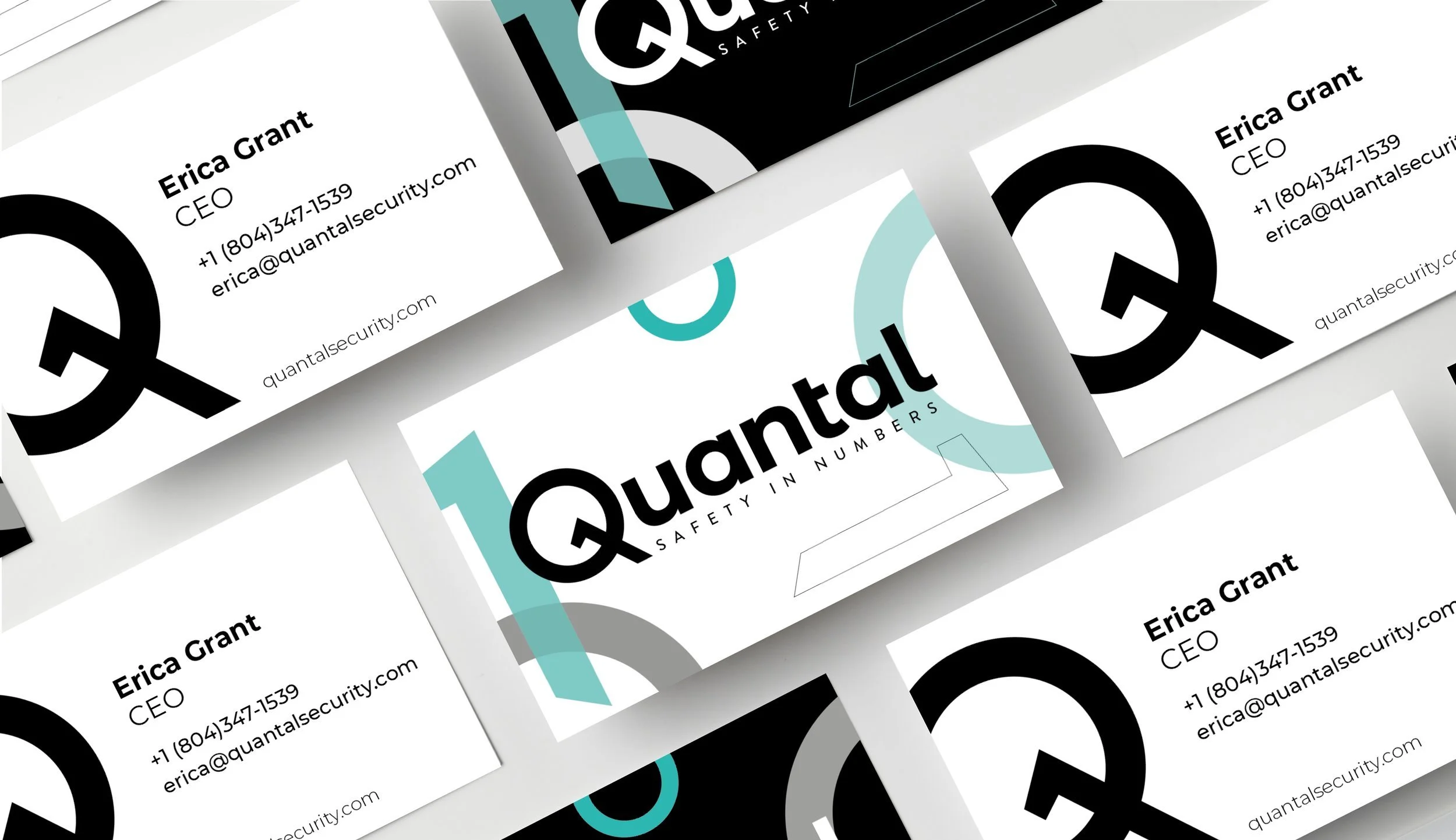 Original Quantal business cards with the key-shaped Q symbol and binary number graphics