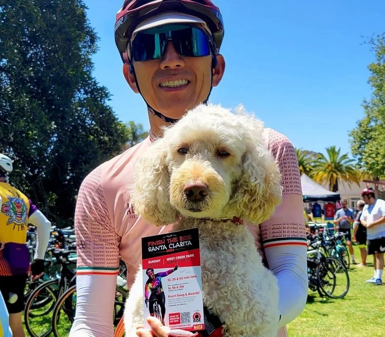 Event participant with a Finish The Ride flyer.