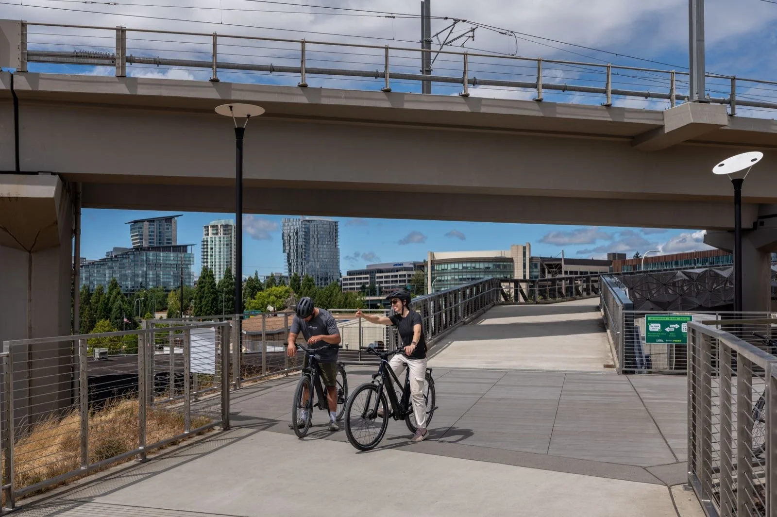 The light rail guideway running beside the Eastrail with downtown Bellevue behind