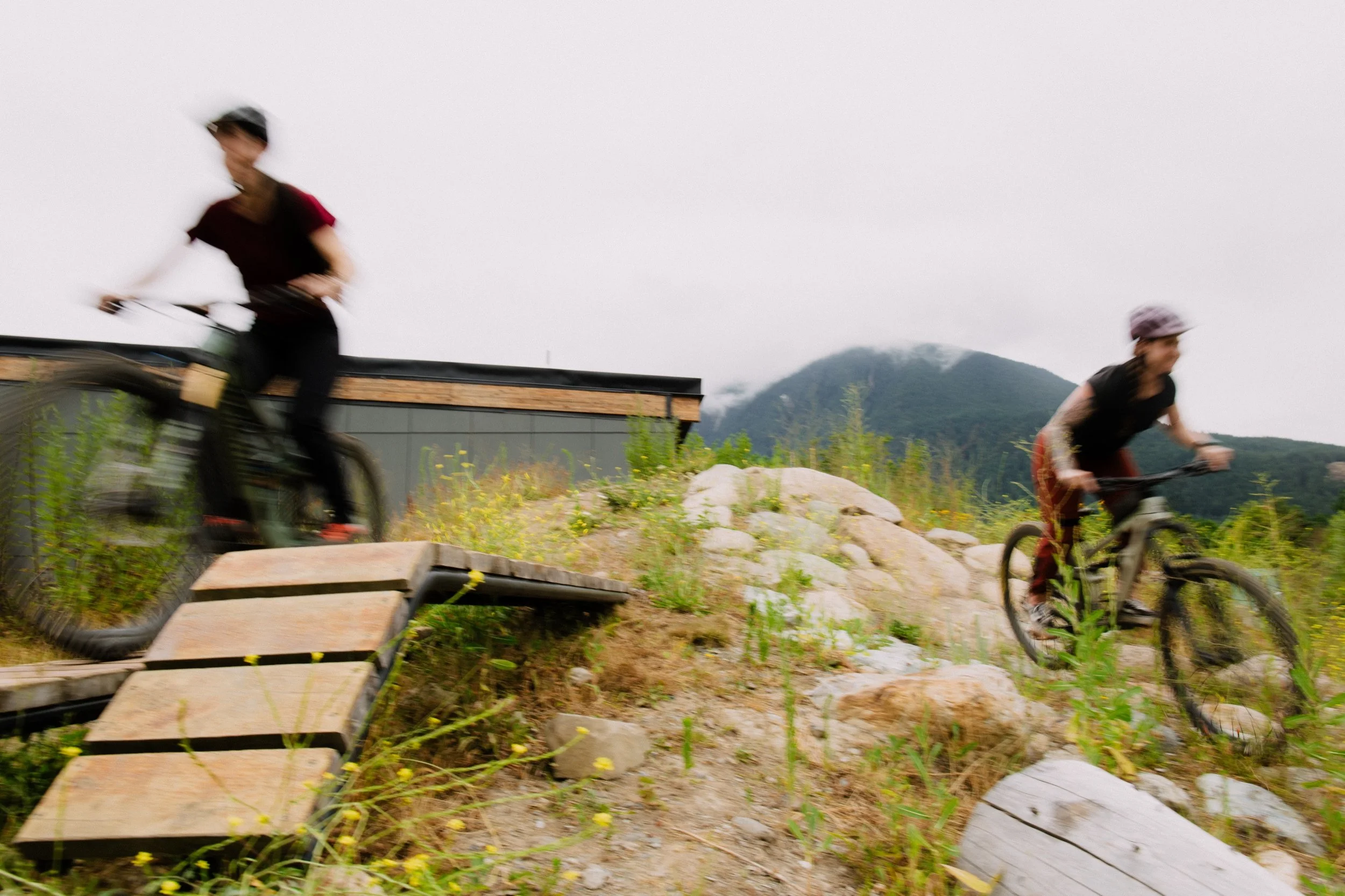 Riders on a jump feature during the Friday Series group ride